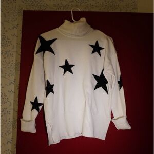 White sweater black stars turtleneck size small